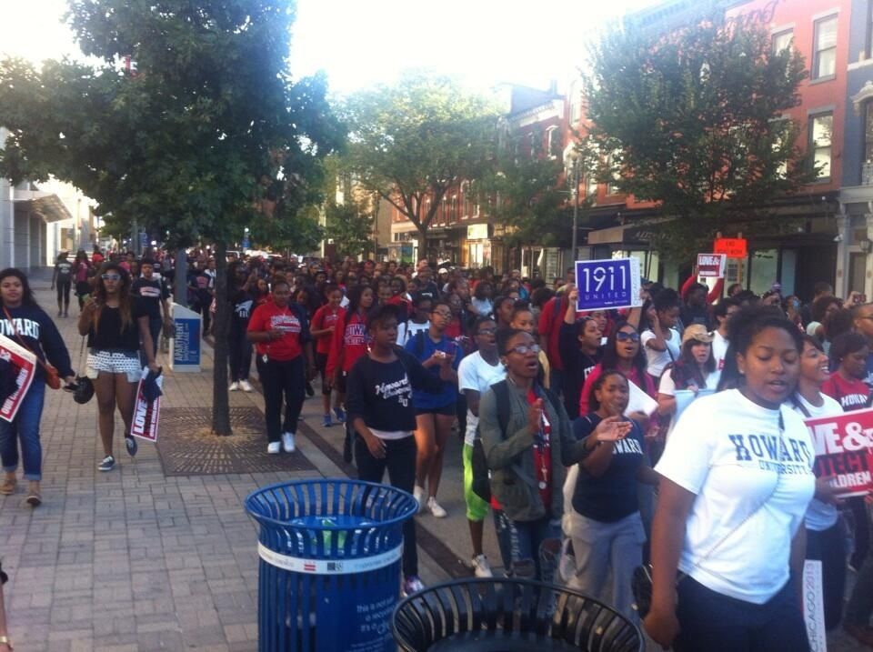 Passing the Carnegie Library, on the way to march. Numbers have swelled. Over a thousand Howard U students.