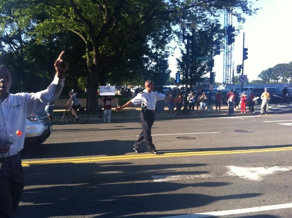  Chief of Police, Leroy James, directing the thousands of marchers, in front of National AfAm Museum. 







