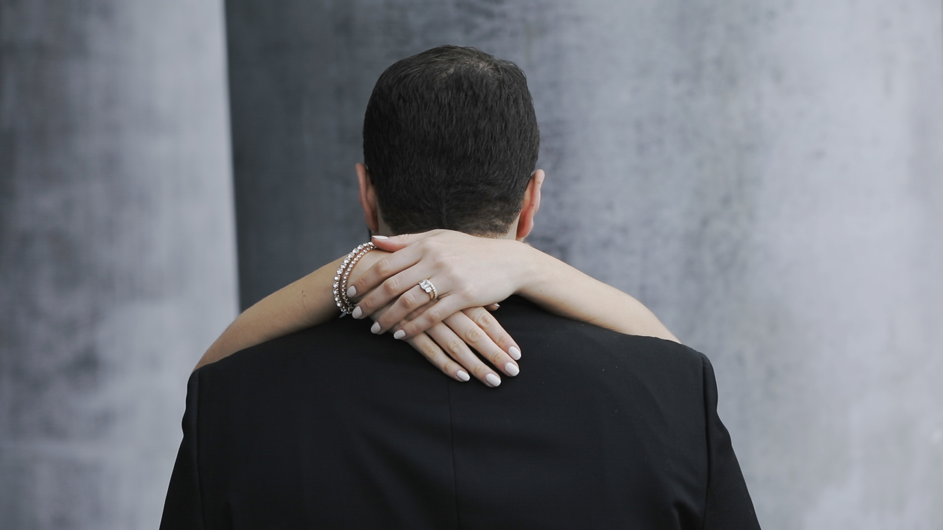 Bride and groom embracing