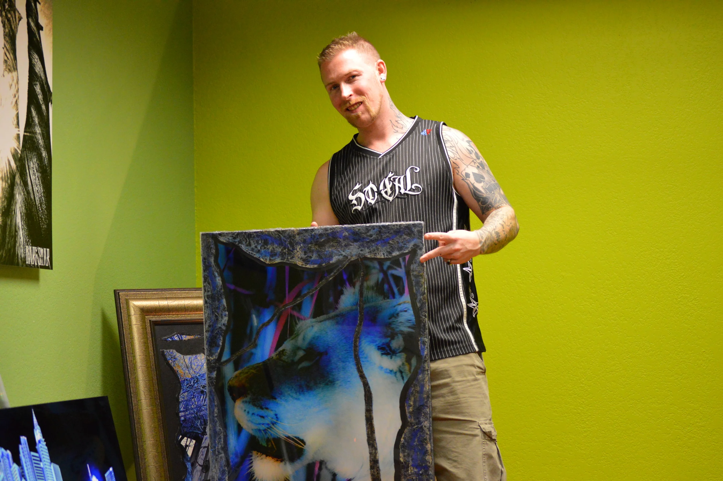 Frankie Darkstar with one of his art pieces