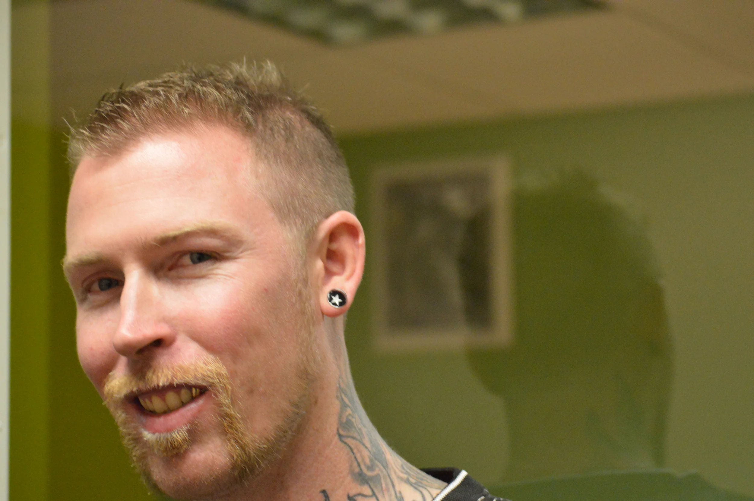 Frankie Darkstar in front of one of his gallery's window