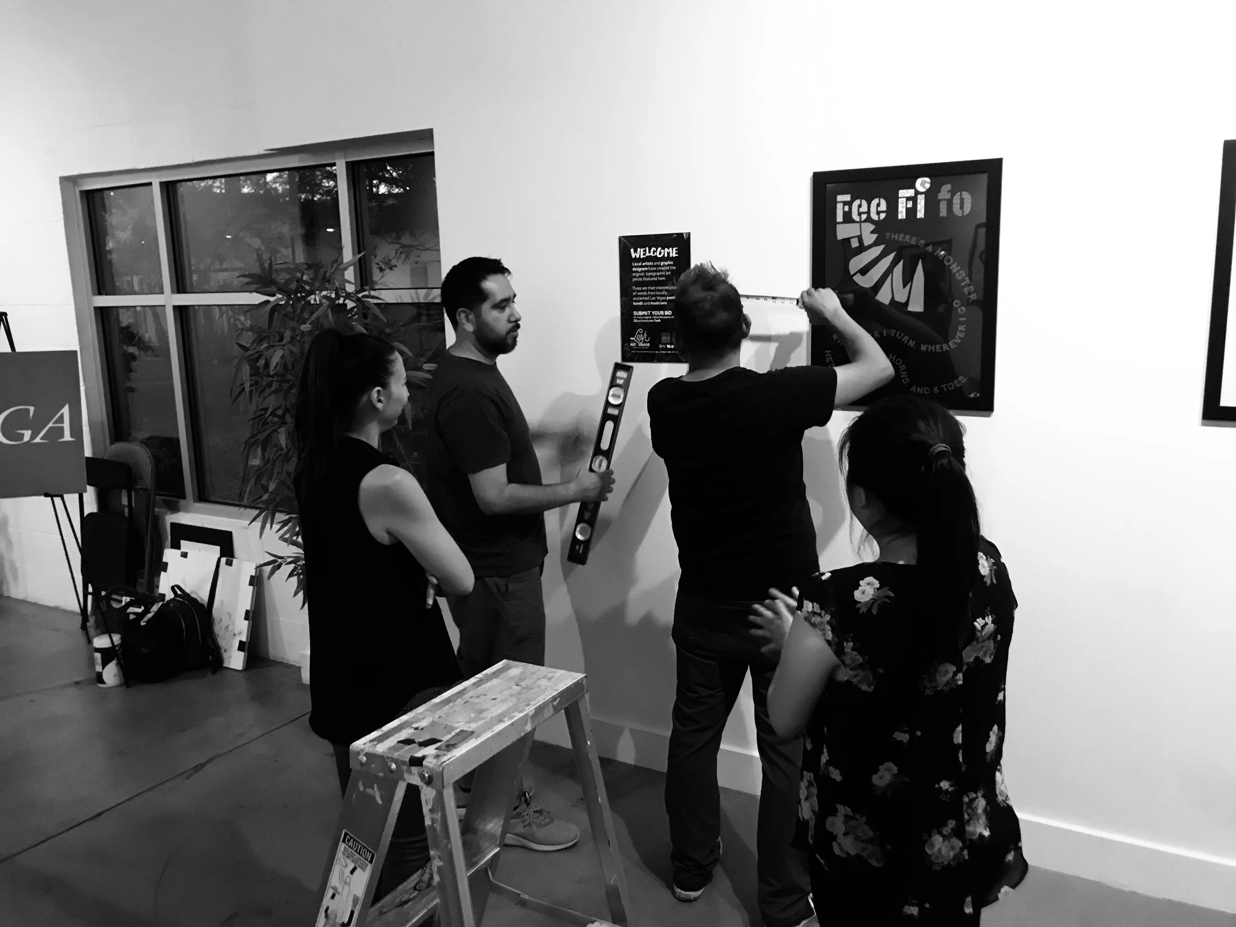 AIGA LV Board of Directors Jennie Marsh, Juan Beltran, AIGA Program Director and Editor In Chief of VIM Magazine Jorge Lara, and Therese Bautista setting up at Escape Artist Studios.