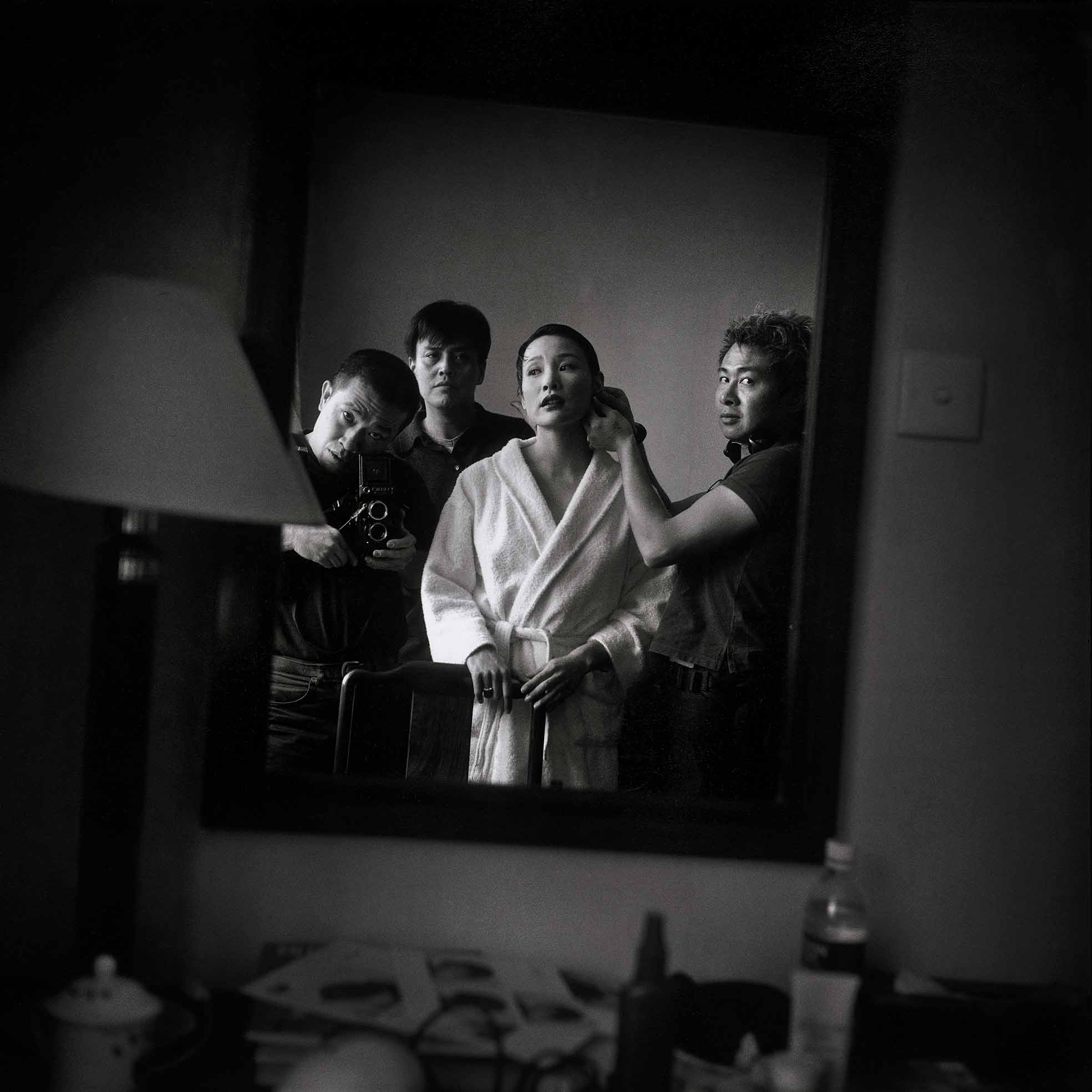Zhang Hai'er, Joan Chen being made up by William Lee, while Sun Zhou and Zhang Hai'er watching, Longhua Hotel, Shanghai, 1999
