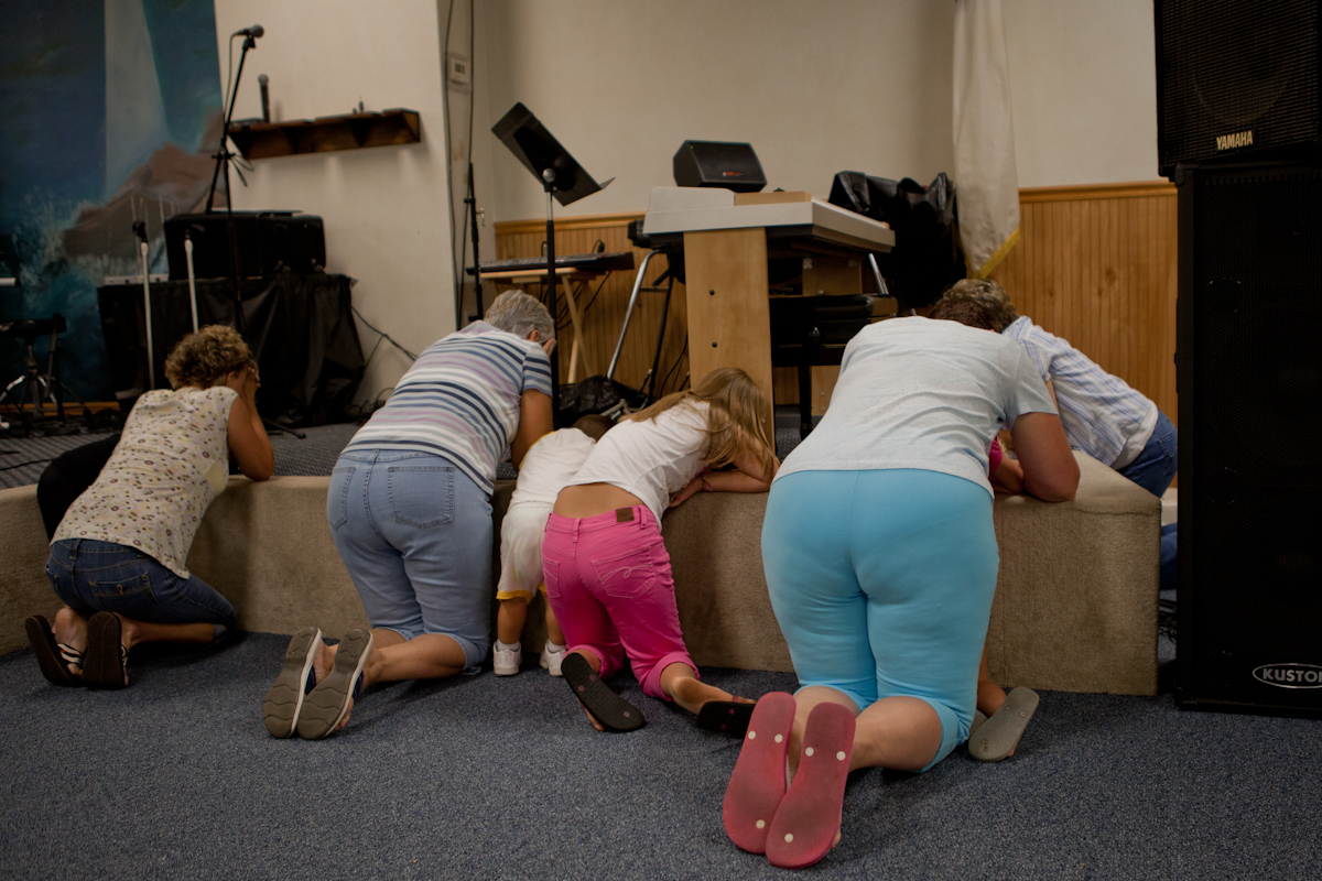 At the Christian Faith Academy in Van, West Virginia, church goers pray during a Wednesday night church service. 