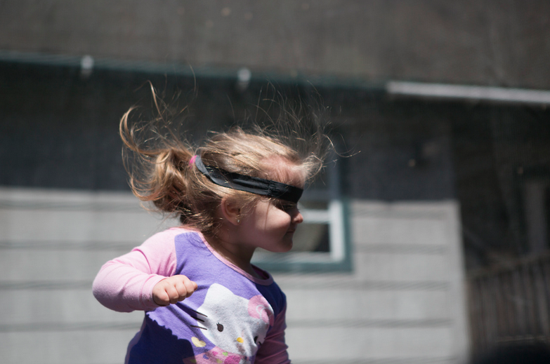 In Van, West Virginia, JayCee Jarrell jumps on a trampoline at her grandparents house. After her parents lost their home, due to job layoffs, they temporally moved into this house. Putting two families under one roof. 