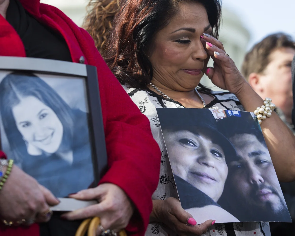 Rosie Cortinas cries as she hold a picture of her son, Amador Cortinas, who was killed on October 18, 2013, while driving a friend home in a Chevy Cobalt. 
