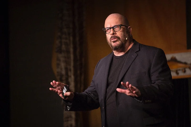 This talk is not just beautiful, funny, and insightful, it is also powerful. Ed Woodham shares how his organization, Art in Odd Places , works to awaken the public... and how that lead to a personal awakening where he least expected it.