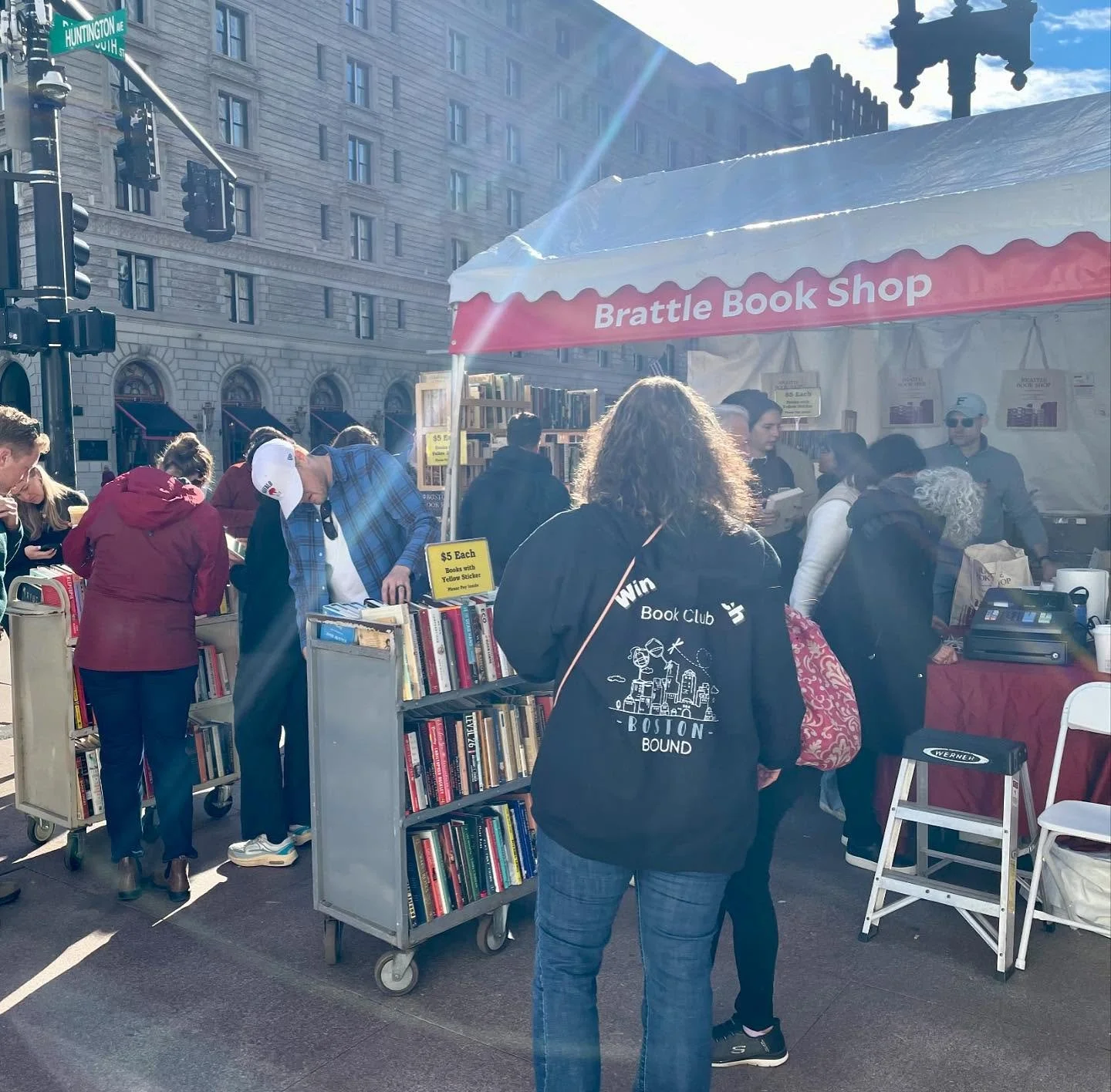 All set up at the Boston Book Festival! Shelves upon shelves of $5 books await, as well as totes from @speakeasy_printshop