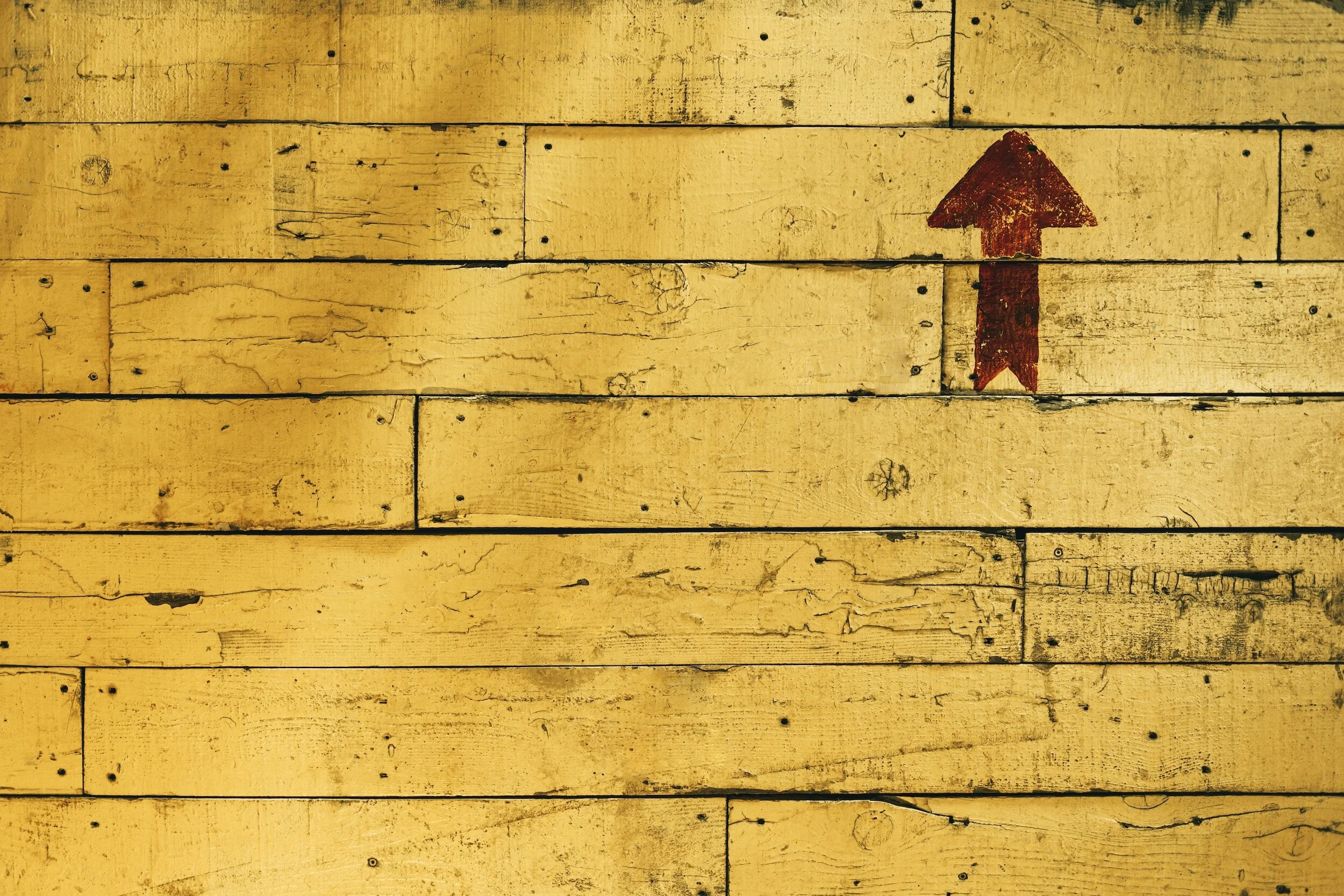 Generalized Anxiety Affirmations: a wooden wall with an arrow pointing upward