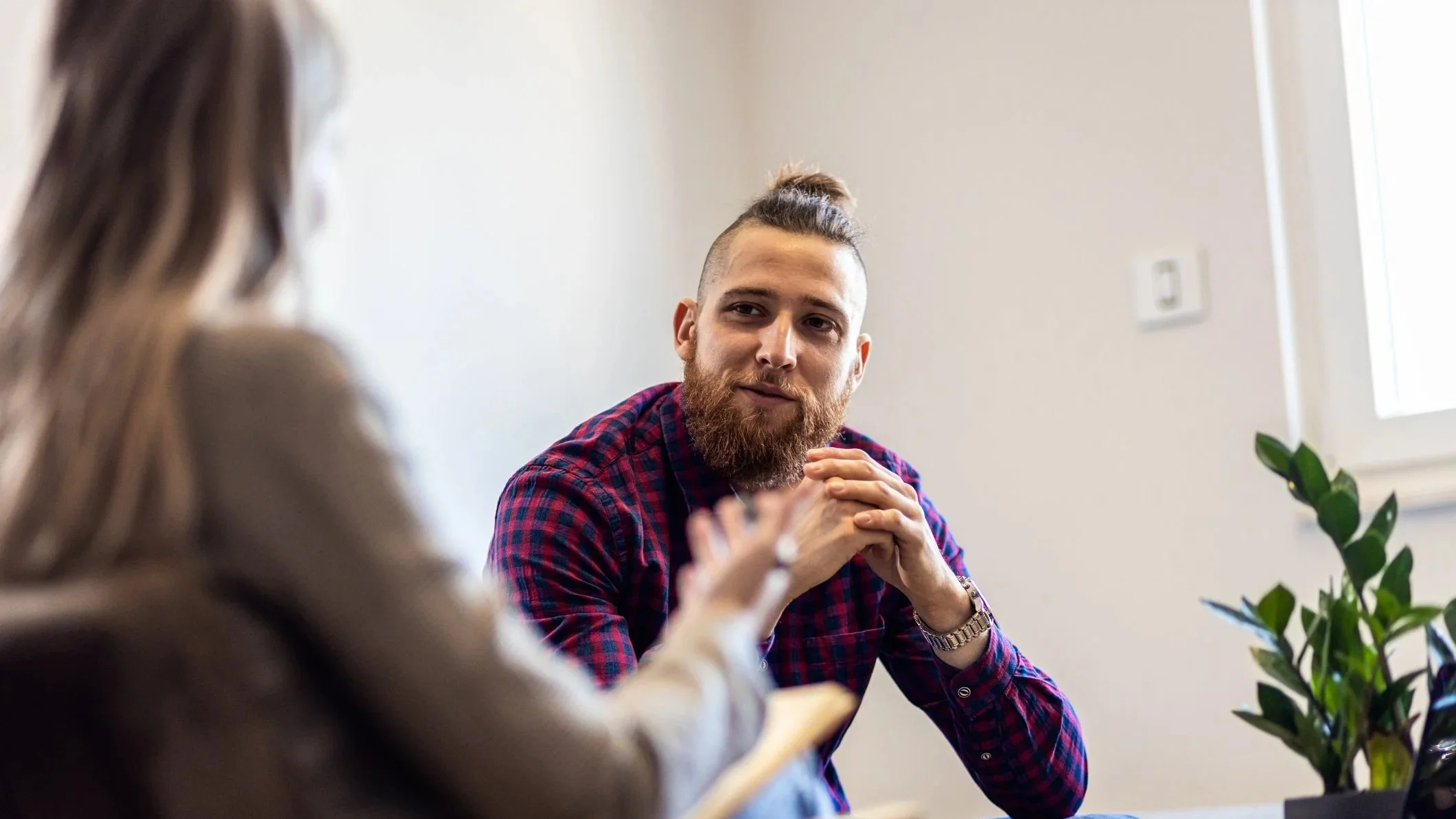 A CBT therapy client smiles in epiphany