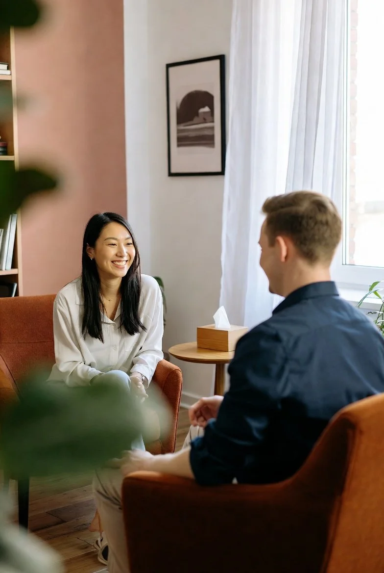 5 Steps to Stop Perfectionism: A perfectionism therapist works with a client in a counseling session.