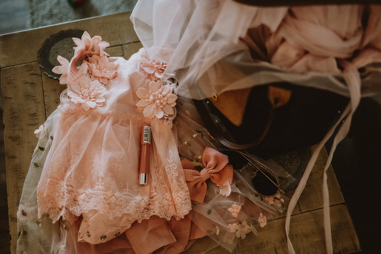 A pink floral dress and accessories