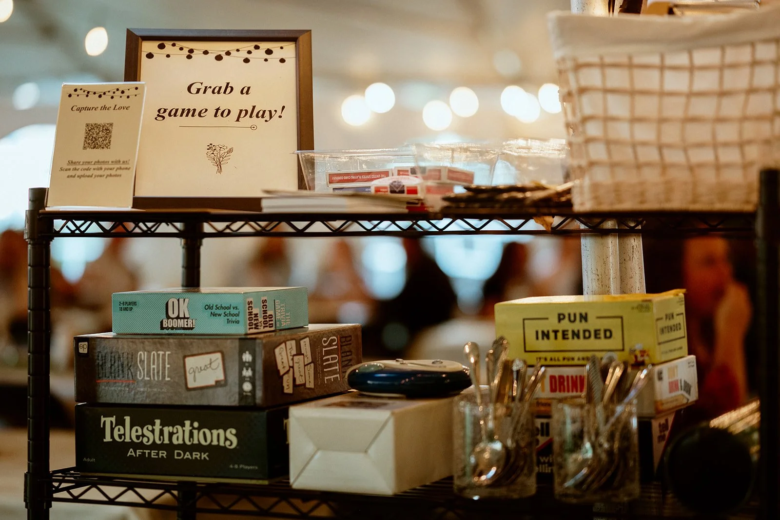 Shelf with board games and sign reading "Grab a game to play!"