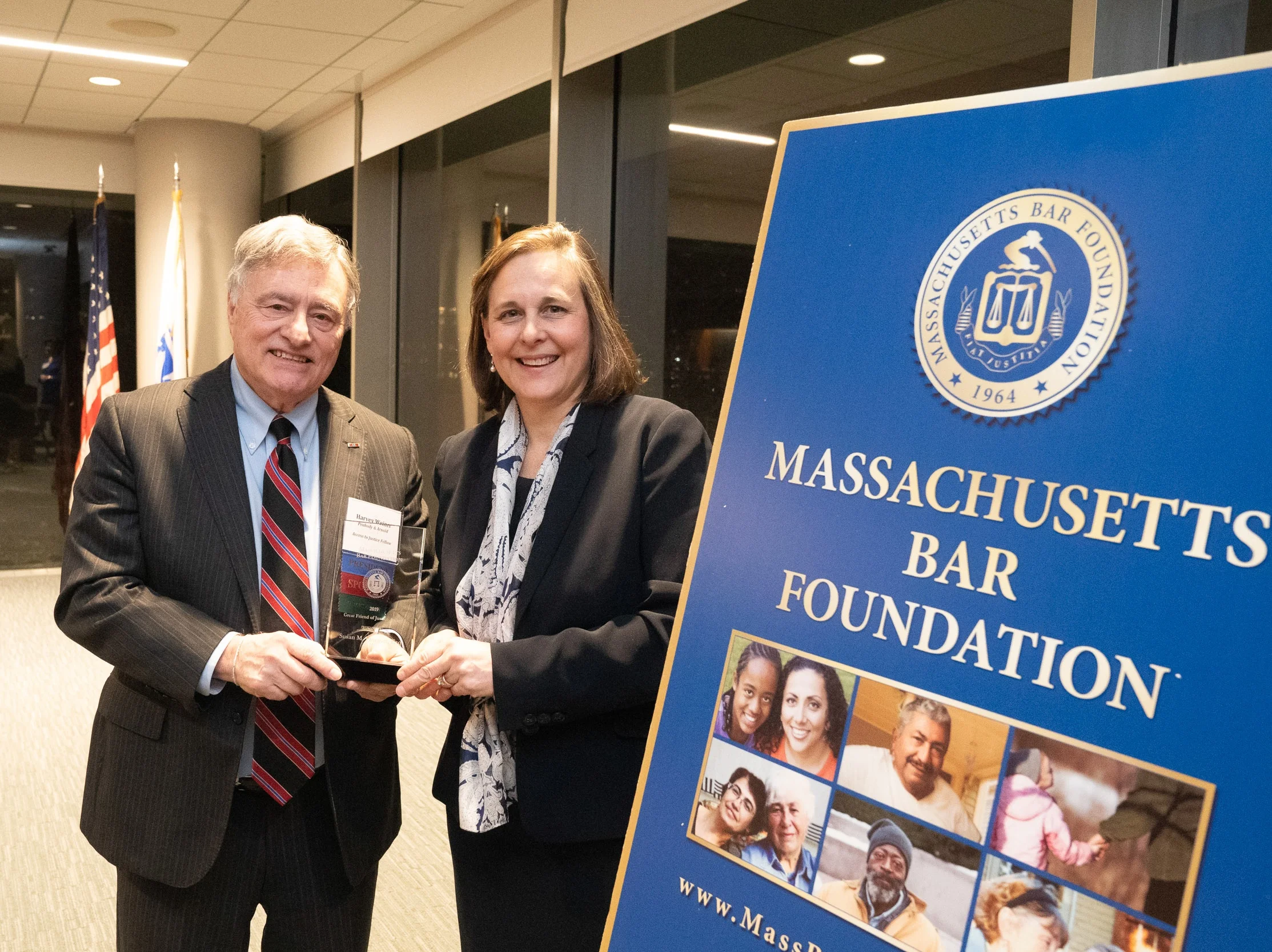 President Harvey Weiner presents Sue Finegan with the 2019 Great Friend of Justice Award