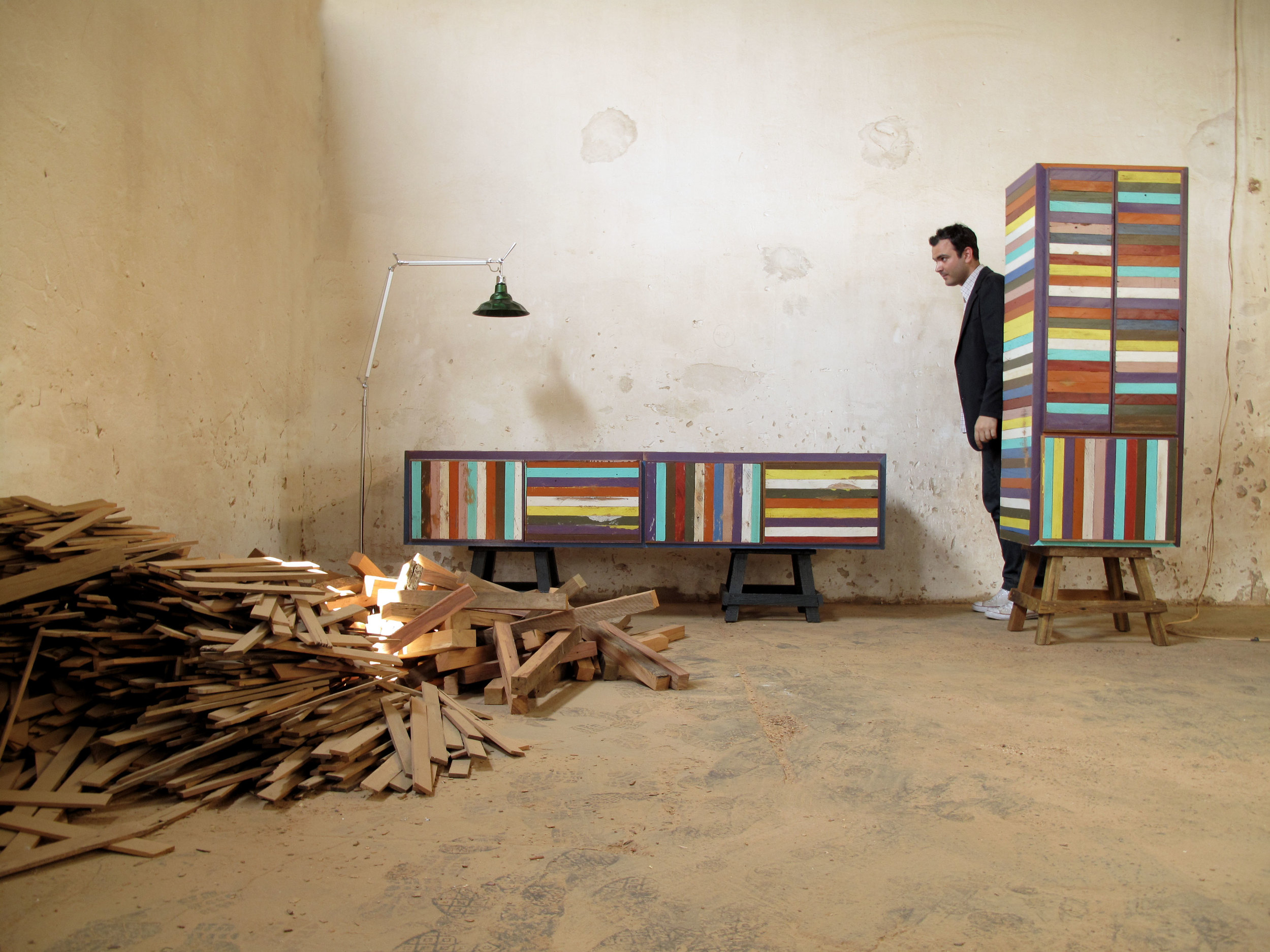 Press release image of Brunno Jahara among examples of Neorustica furniture