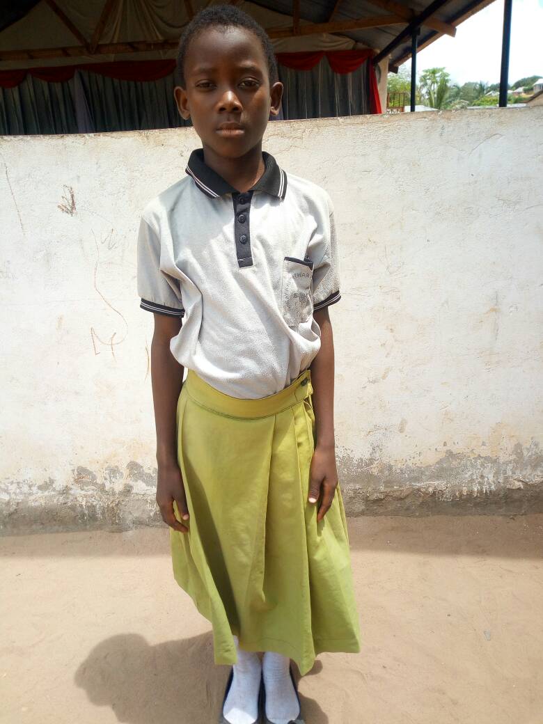 In uniform at the Compassion Student Center. Her favorite subject is science and she hopes to become a nurse. 