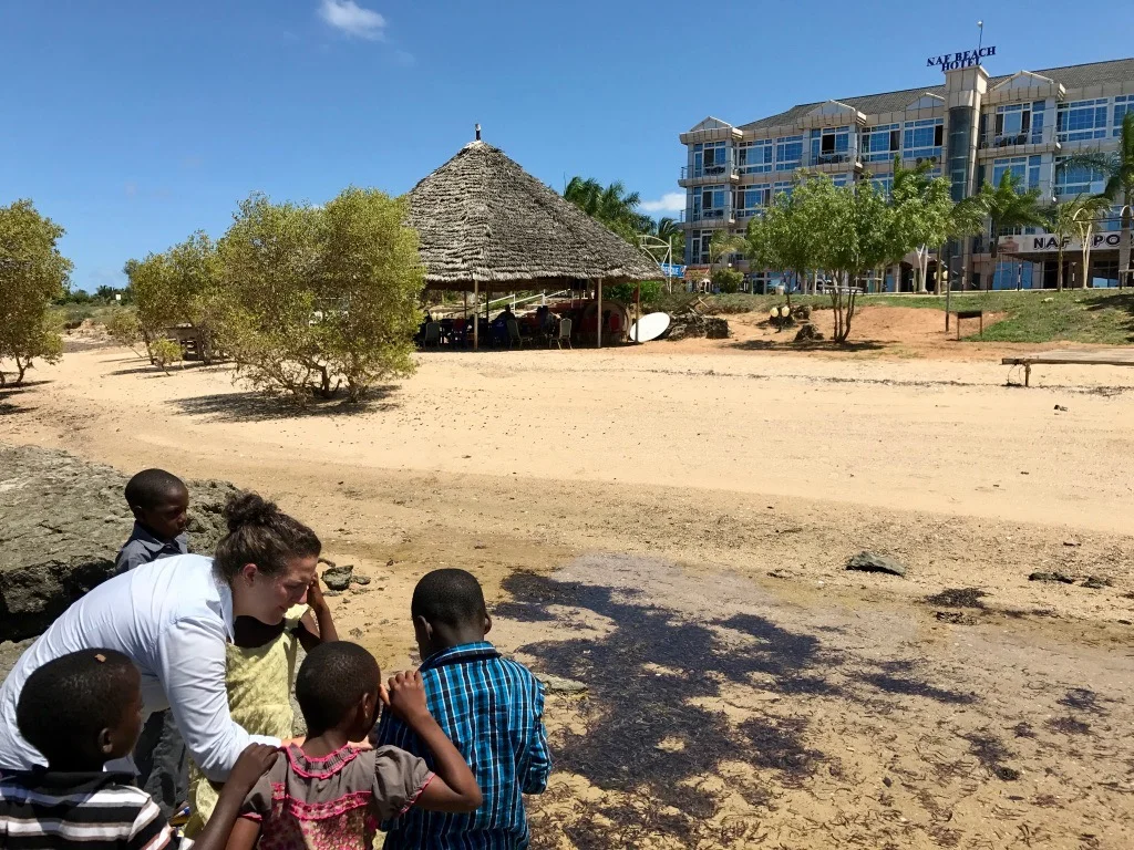 Exploring the tide pools near the thatch roof restaurant at the NAF Beach Hotel.