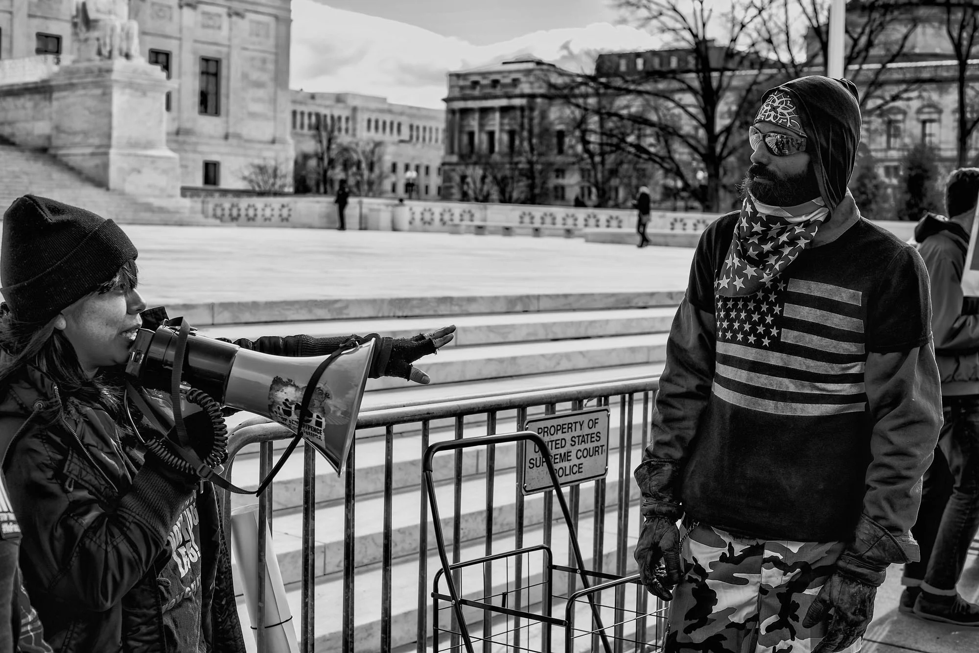 A pro-life and pro-choice demonstrator debate in front of the US Supreme Court in Washington, DC, on March 27, 2017.