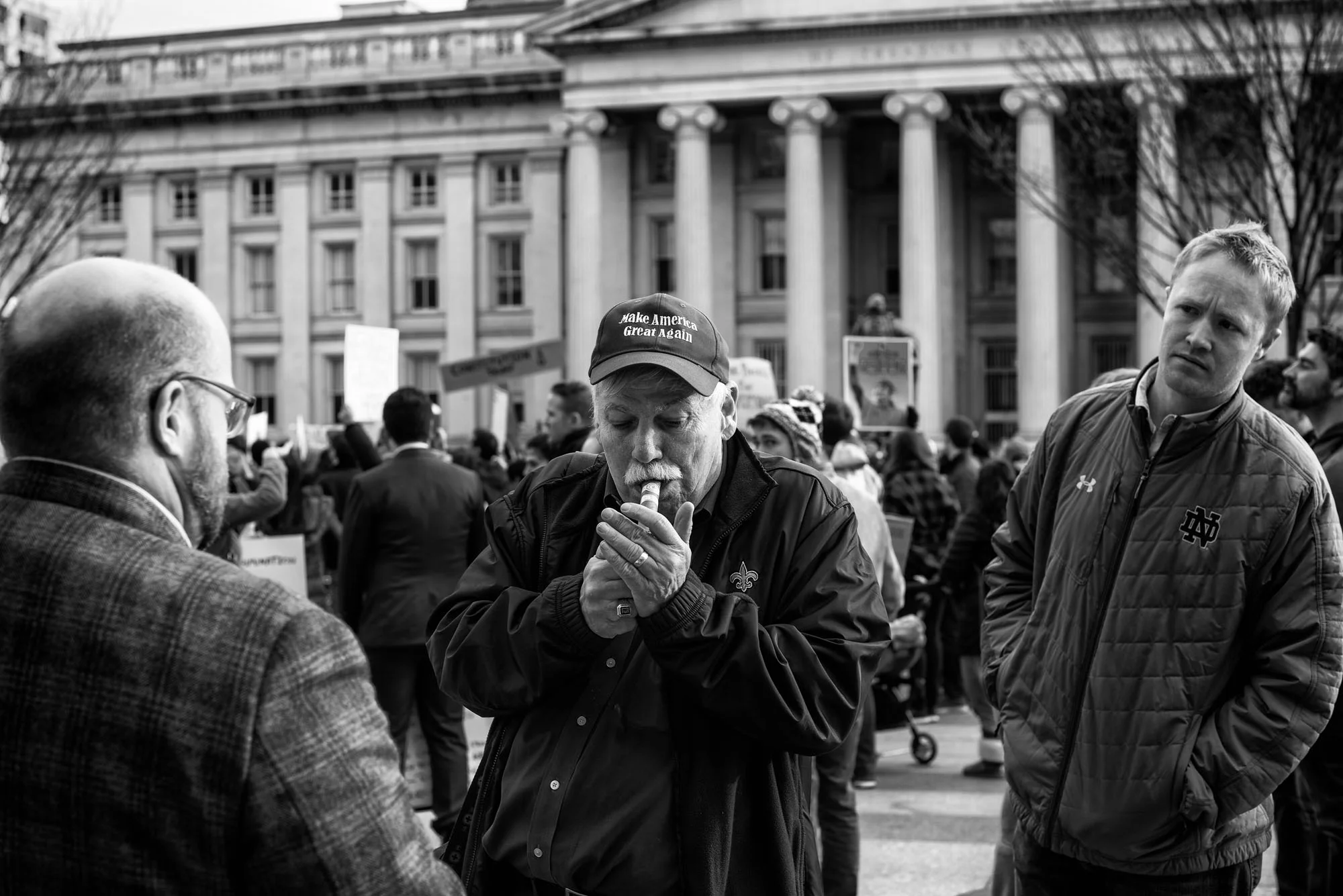 A Trump supporter speaks with protesters near the White House after President Trump's executive order banning people from seven countries from entering the United States, on January 29, 2017.