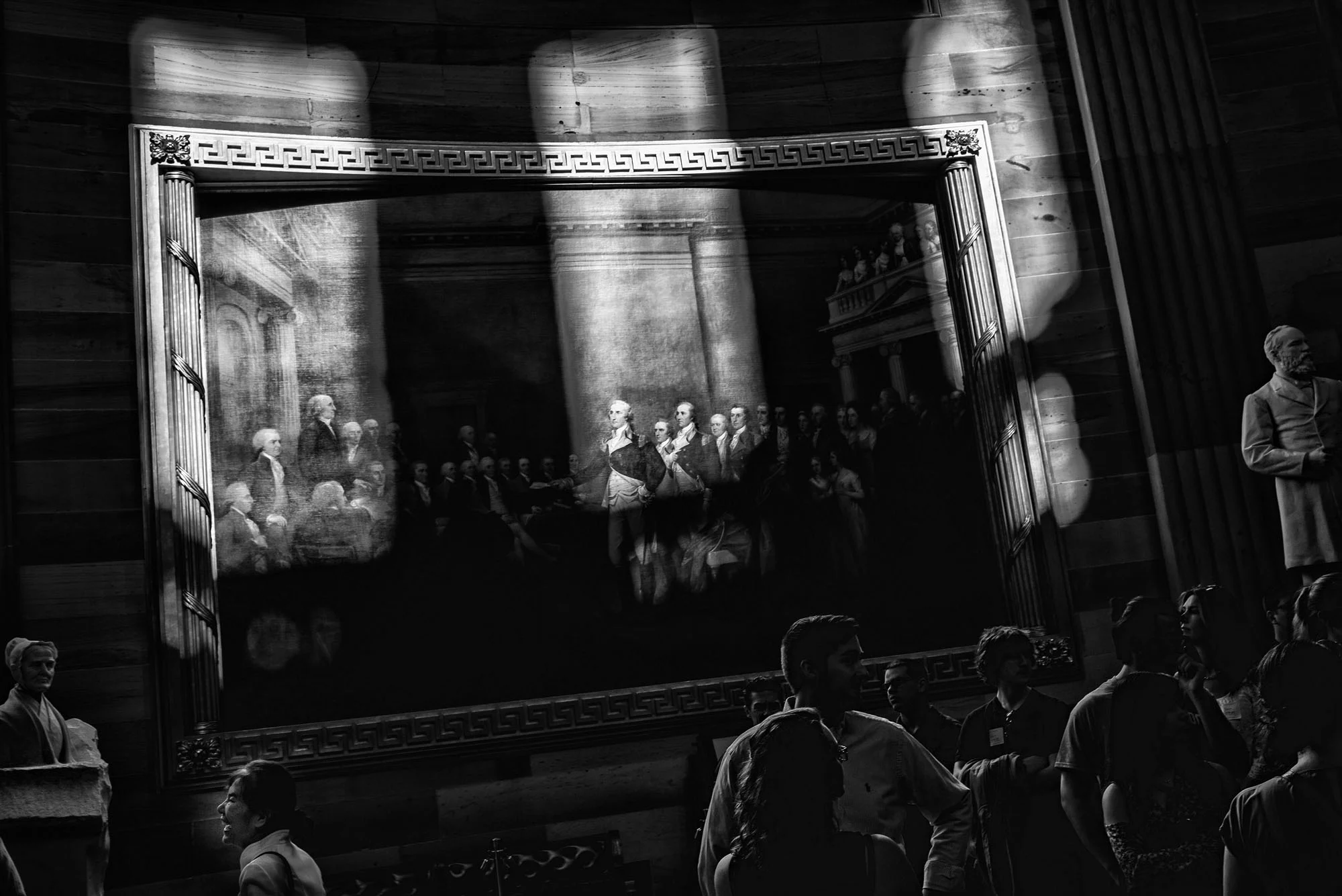 Tourists in the Rotunda of the US Capitol near a painting of General George Washington resigning his commission on February 24, 2017.