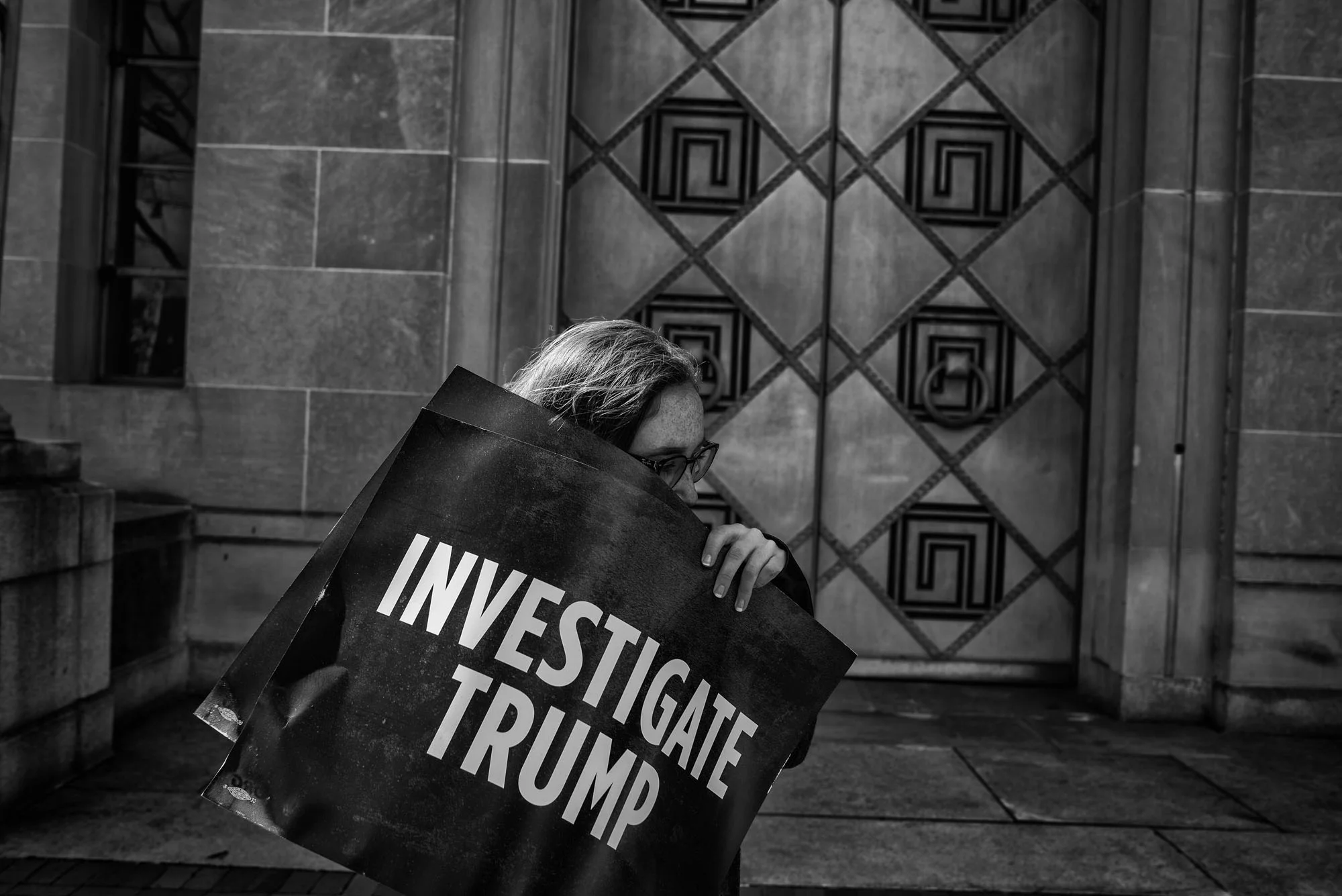 A protester outside the US Department of Justic demanding Attorney General Jeff Sessions recuse himself from any investigations into Russia, on March 2, 2017.
