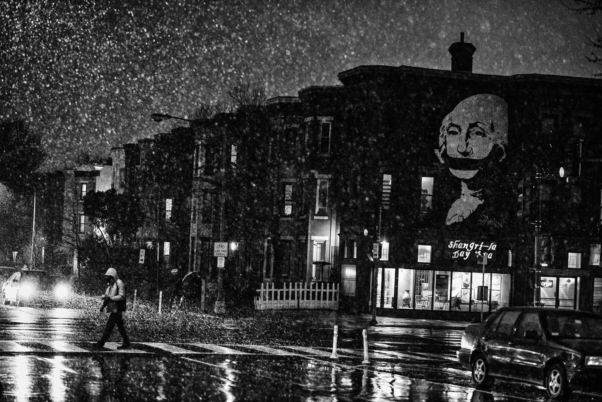 A mural of President George Washington with a gag over his mouth, during a snowstorm in Washington, DC, on March 13, 2017.