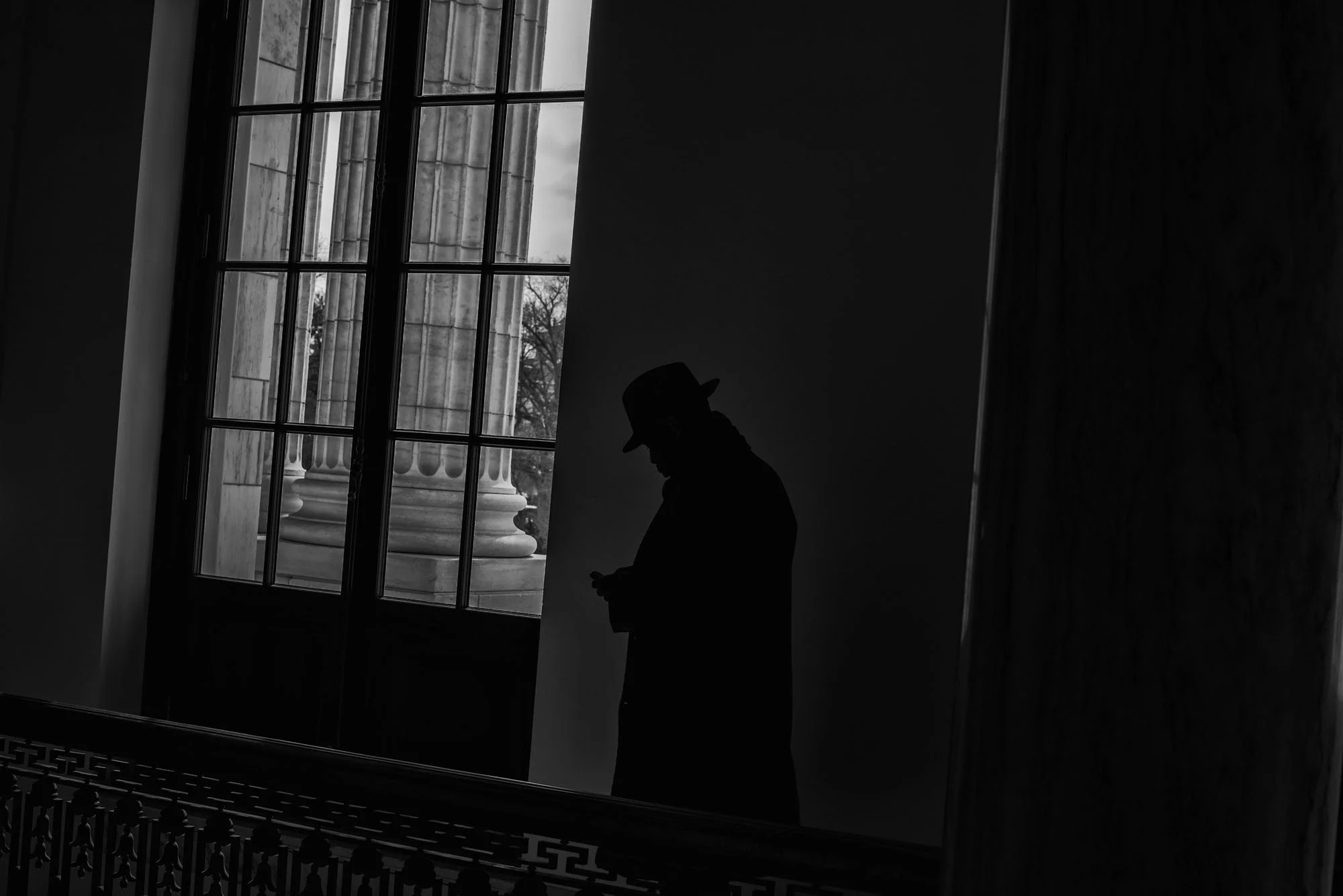 A man checks his cell phone in the US Capitol on March 15, 2017.