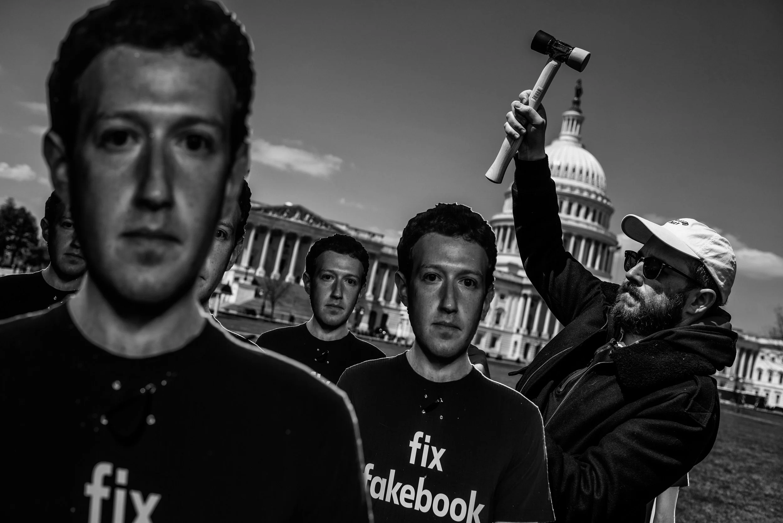 Day 446: Will Davies, a campaigner for Avaaz secures a cardboard cut-out of Facebook CEO Mark Zuckerberg on the south east lawn of the US Capitol, in Washington, DC on Tuesday, April 10, 2018.