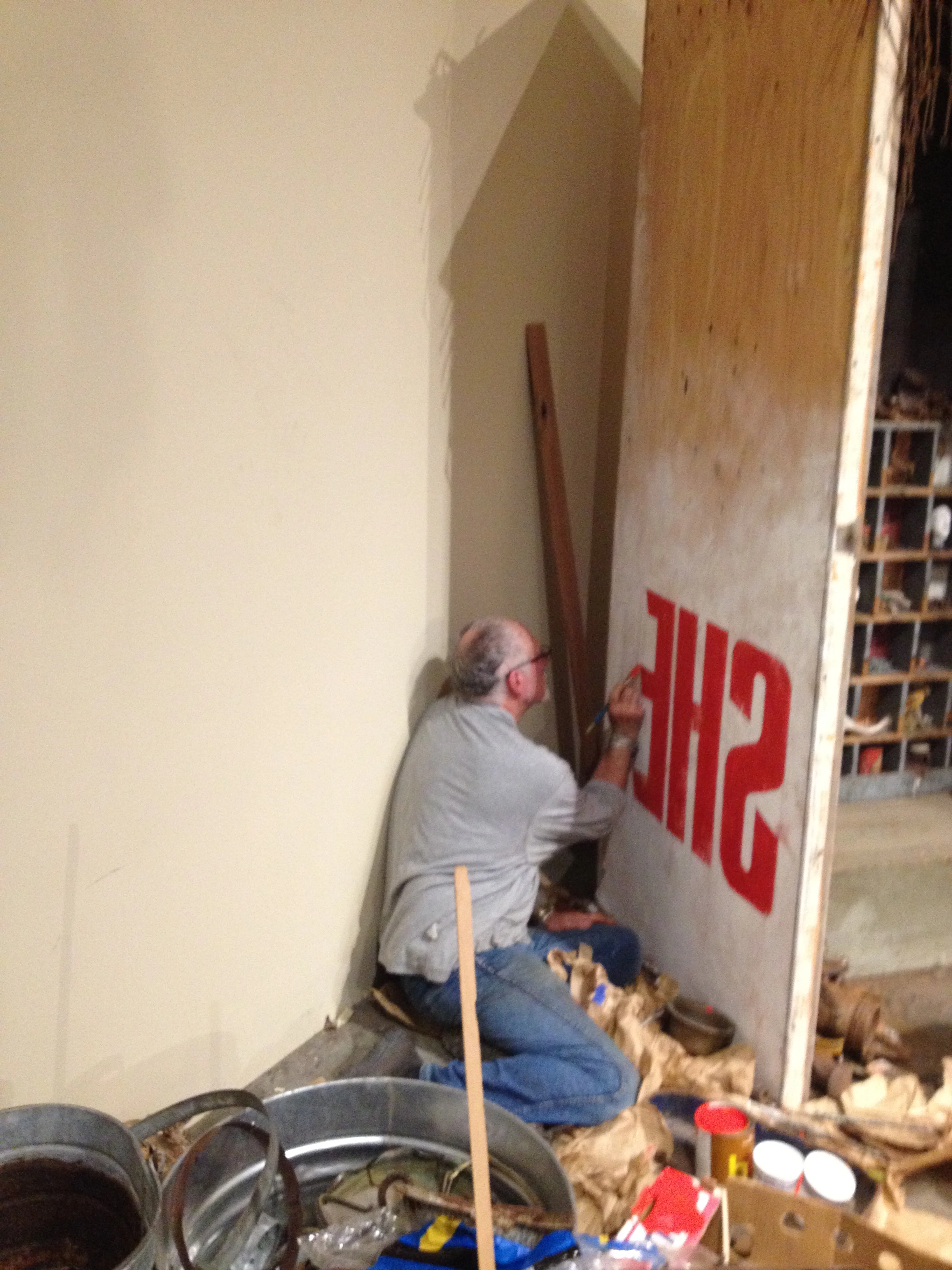 Old school hand sign painter Don G. working on Gardener Will B.'s shed installation.