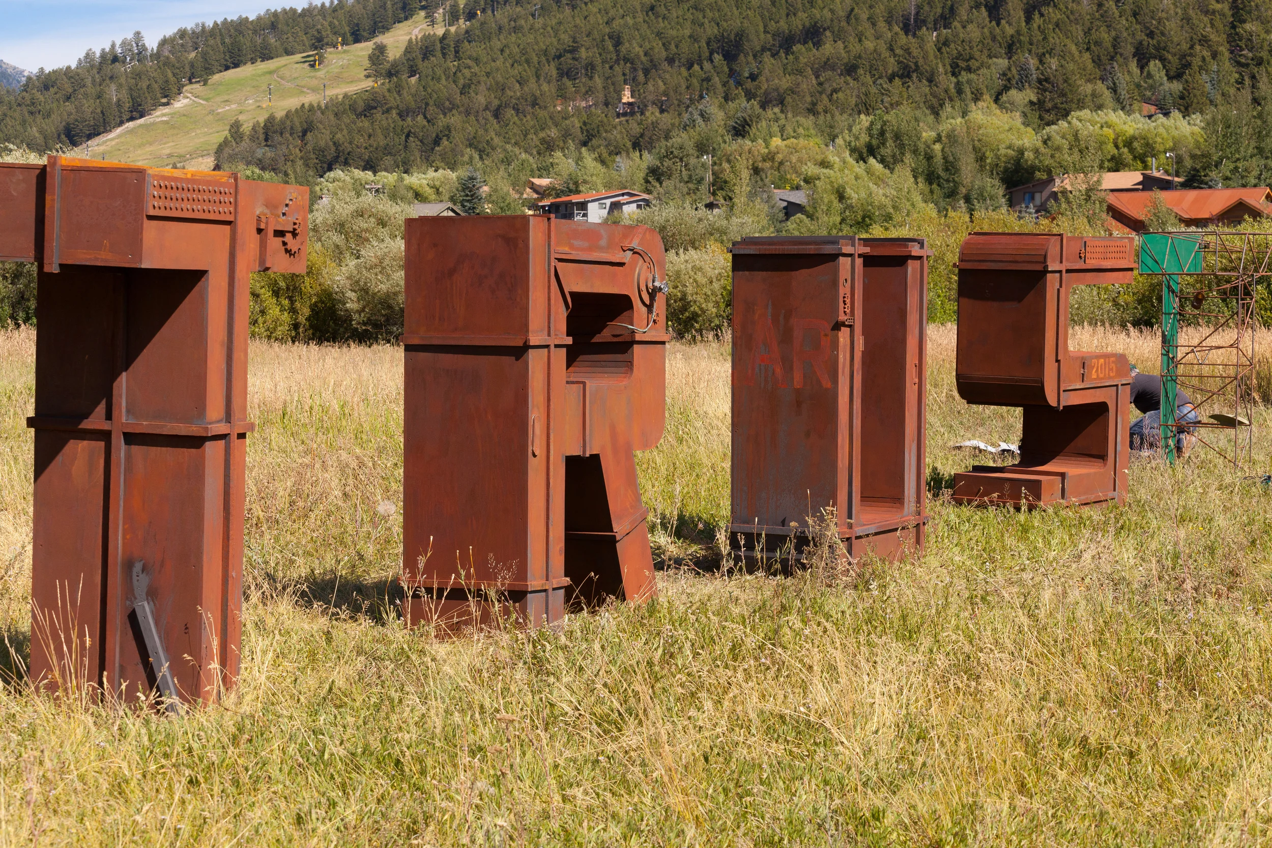 We made huge six foot tall letters- as - sculpture..think Richard Serra / Robert Indiana...and let folks paint on them with watered down mud ....a local poet-teacher's idea....brilliant!