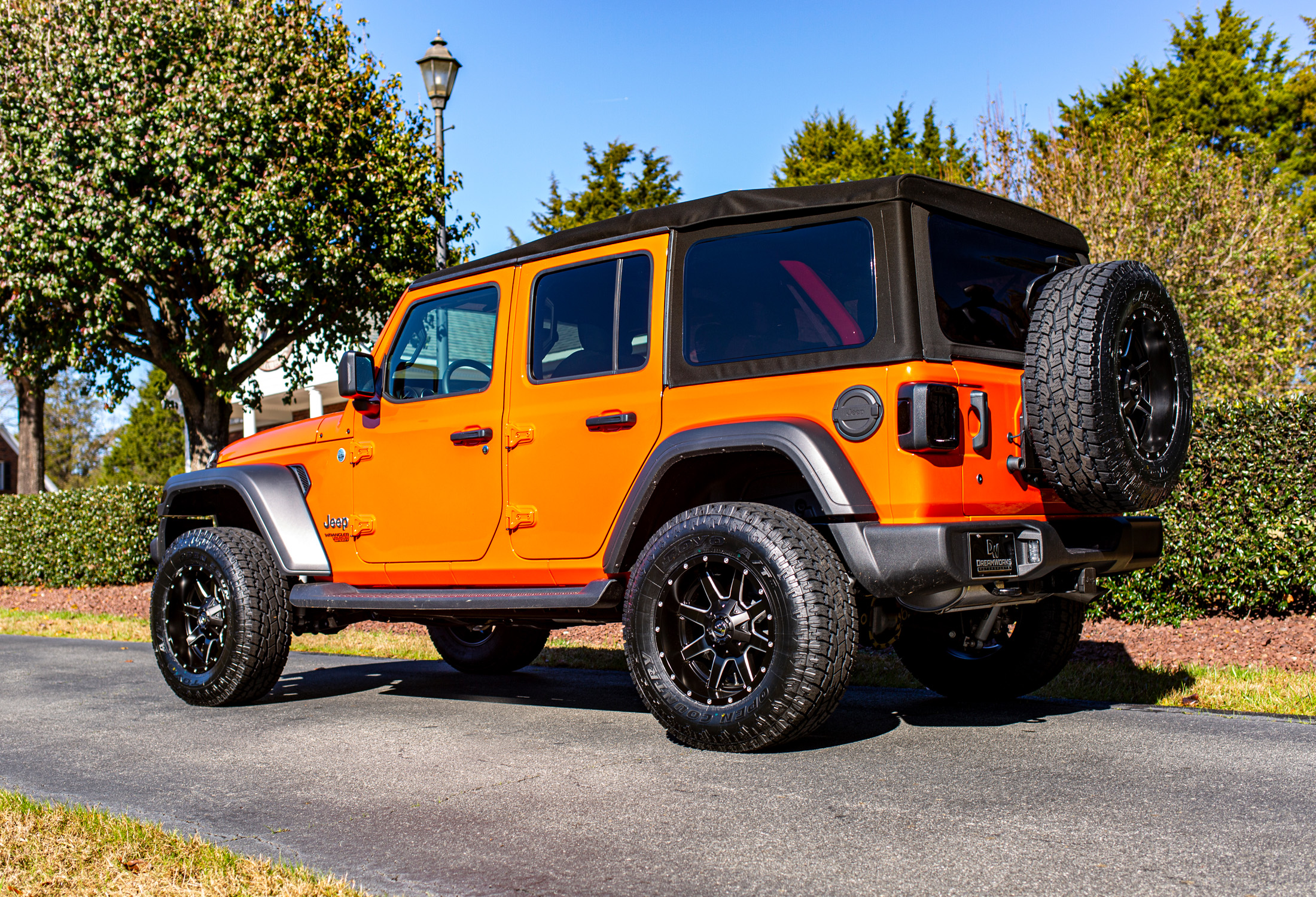 Orange JL Wrangler Jeep — Dreamworks Motorsports