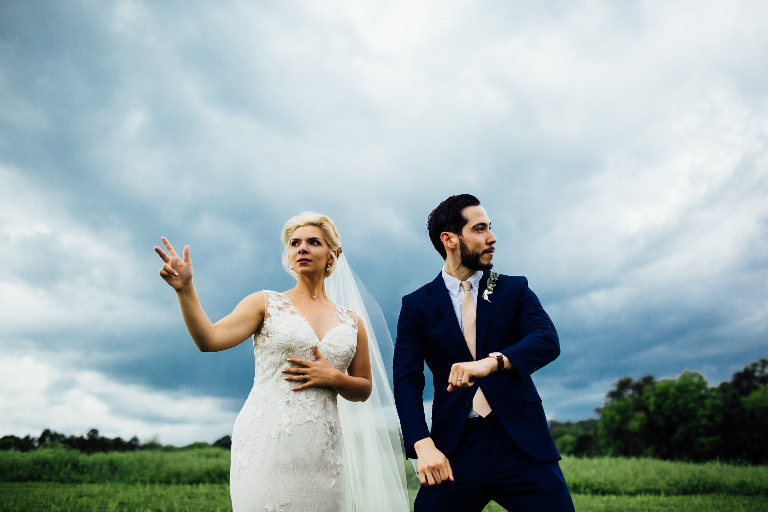 bride and groom fun dance moves stormy sky