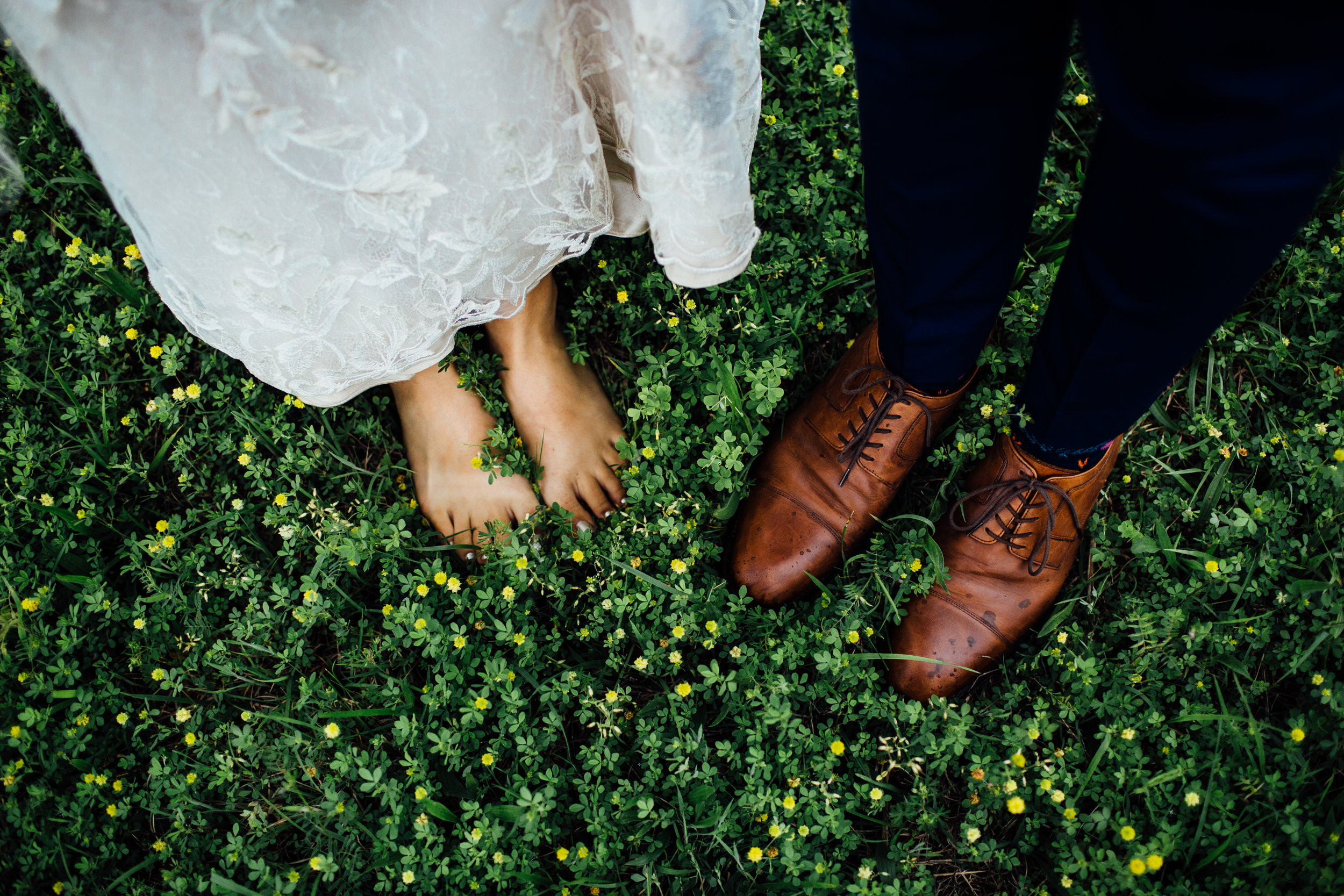 feet in the grass little flowers