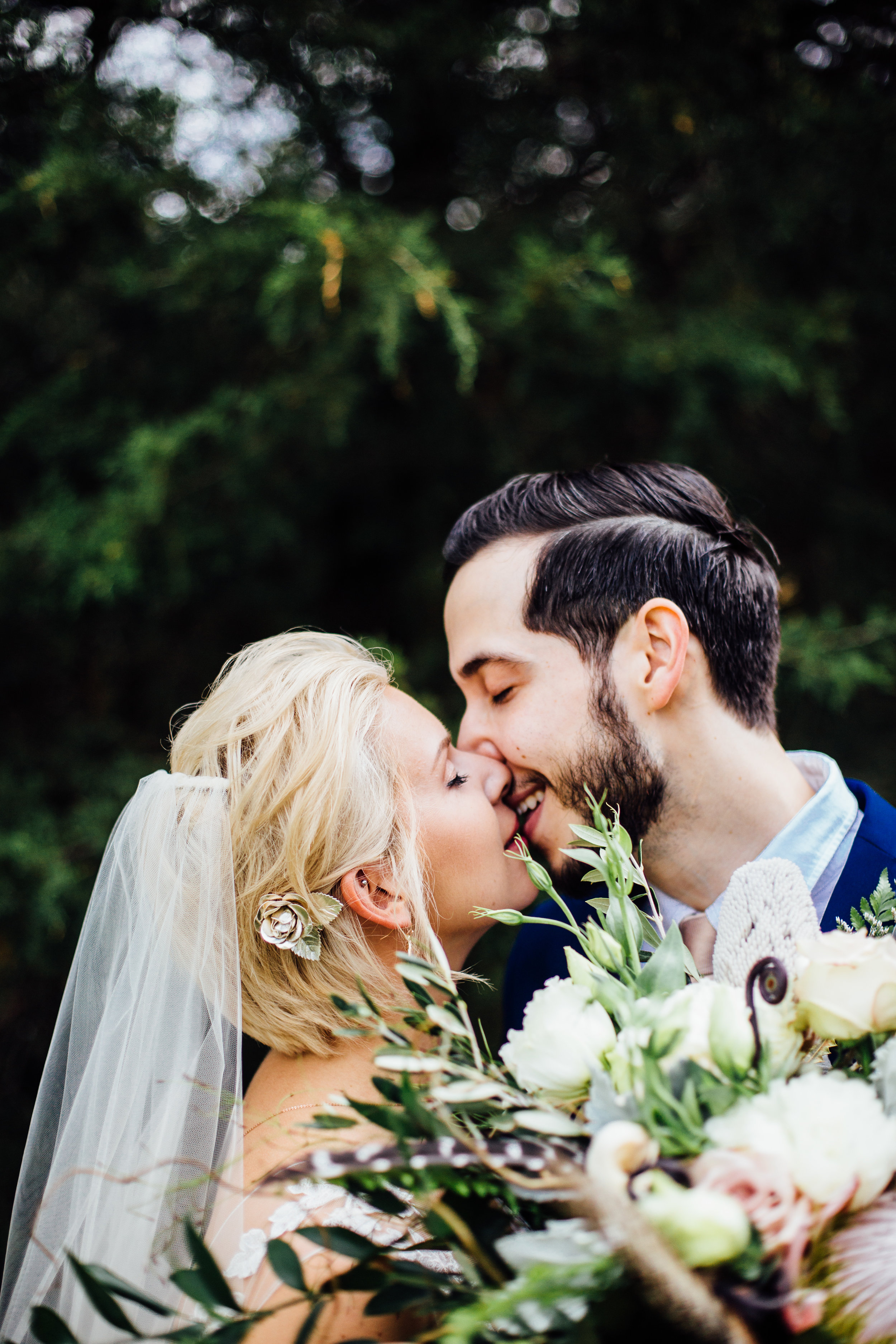 kissing bride and groom