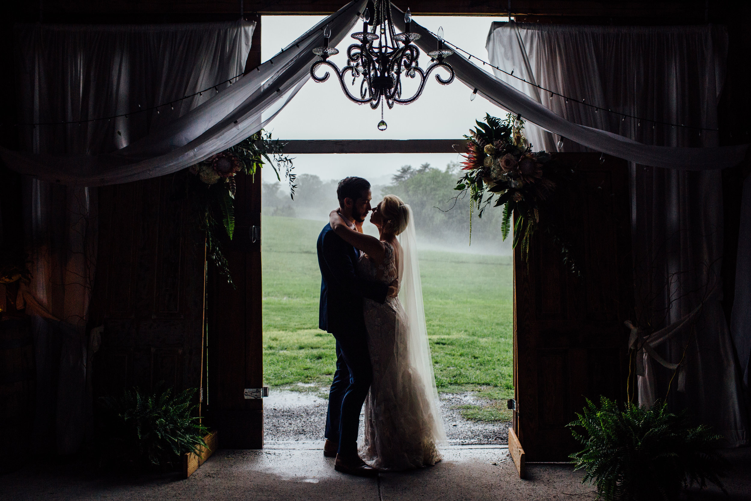 bride and groom silhouette inside barn at drewia hil