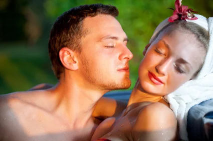 Man sniffing the neck of an attractive woman