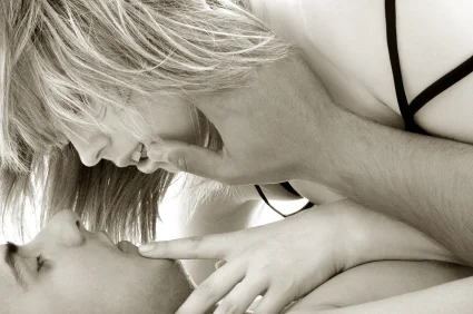 Passionate couple with the woman on top of the man