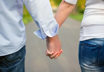 Couple holding hands