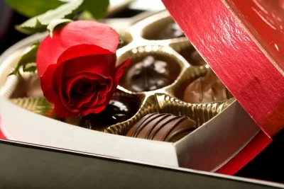 Valentine's Day box of chocolates with a red rose