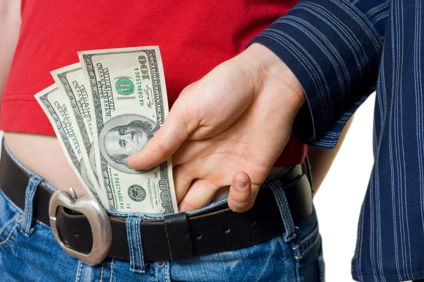 sliding-money-down-pants-prostitution.jpg