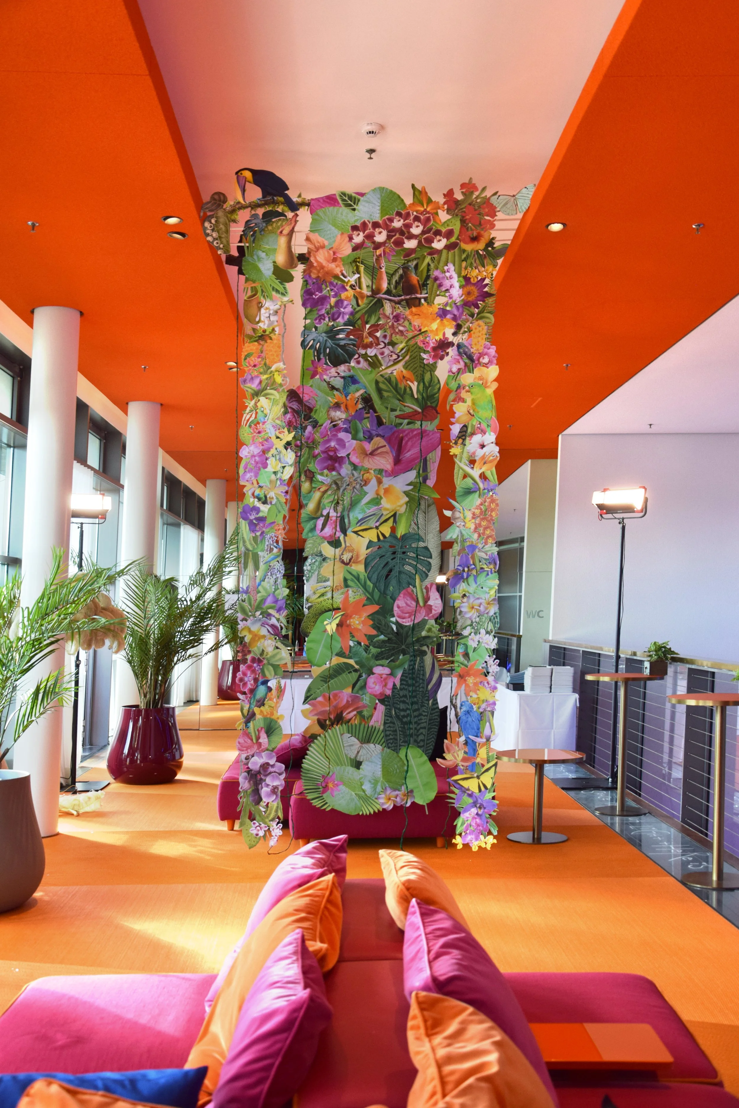 Custom event backdrop by Clare Celeste Börsch featuring nature-inspired collage, designed to scale and installed for an immersive guest experience