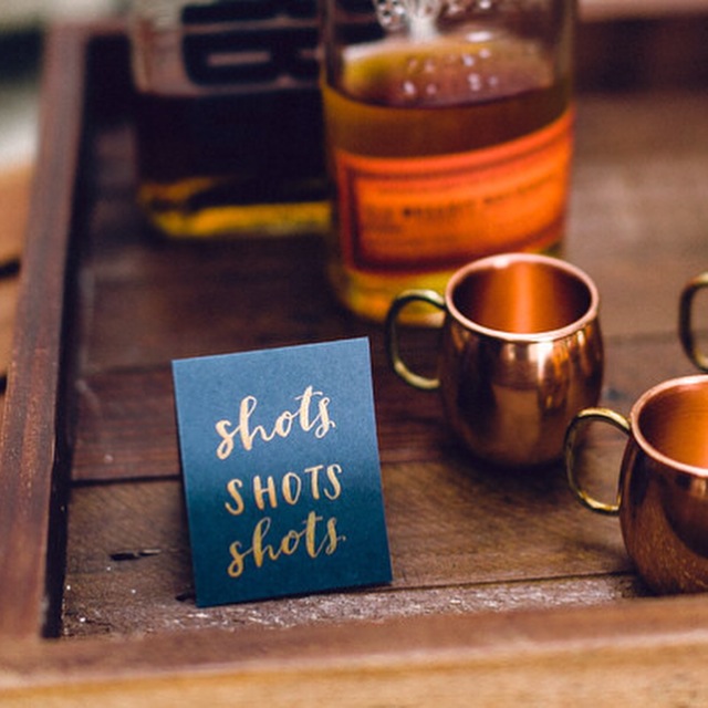 hello, bird. gold ink calligraphy on navy // shots station signage //photo courtesy of Danfredo Photos + Films