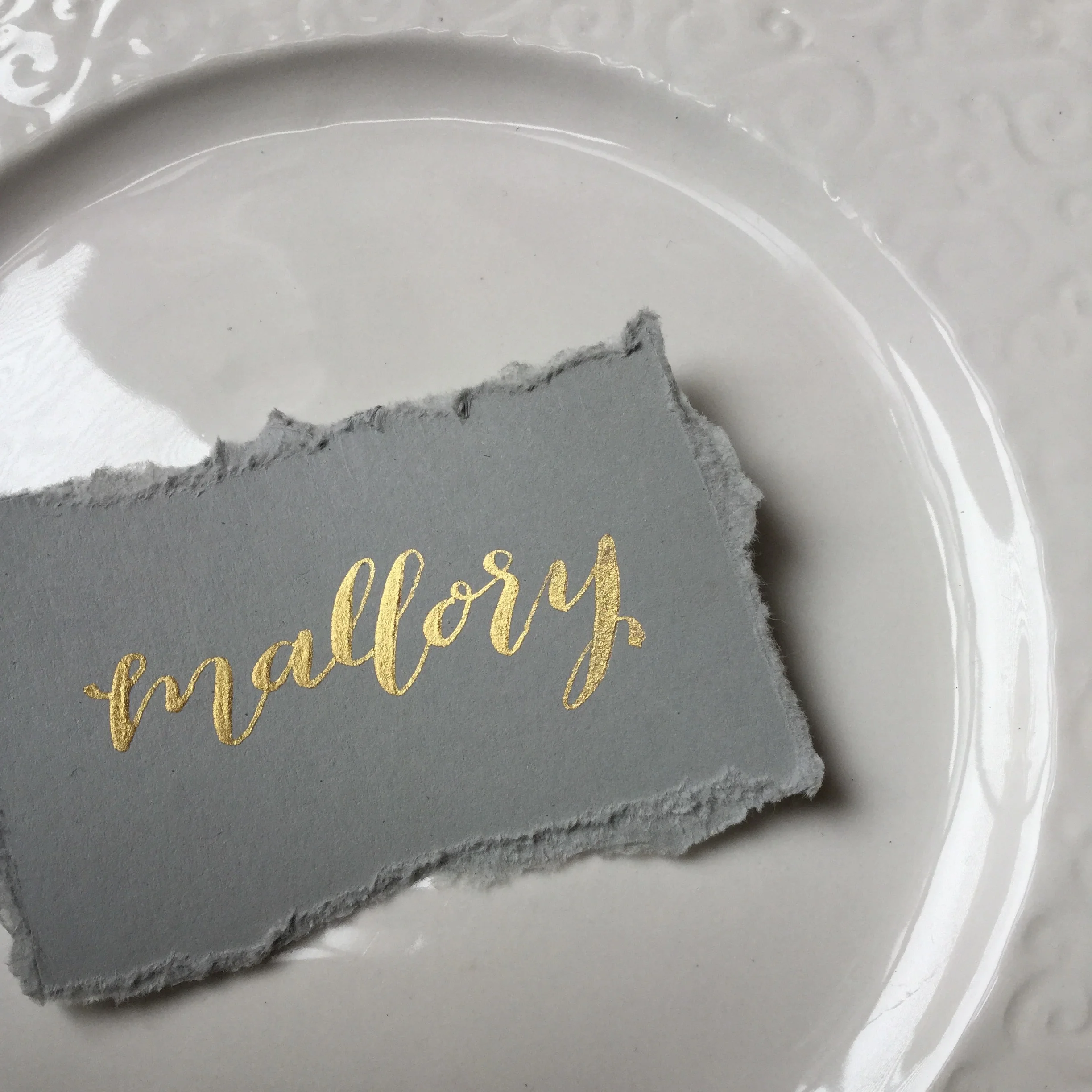  gold ink calligraphy on gray deckle edge placecard by hello, bird. 