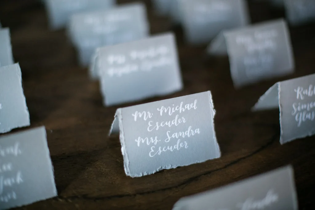  deckle edge escort cards calligraphy by hello, bird. // photo courtesy of peach plum pear photography 