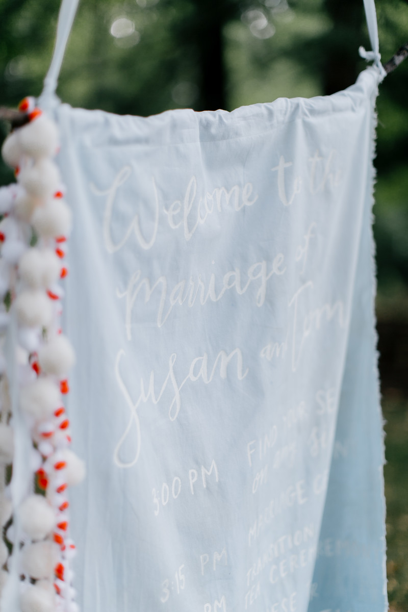 hand-dyed and lettered fabric ceremony program by hello, bird. // photo courtesy of Emily Wren Photography