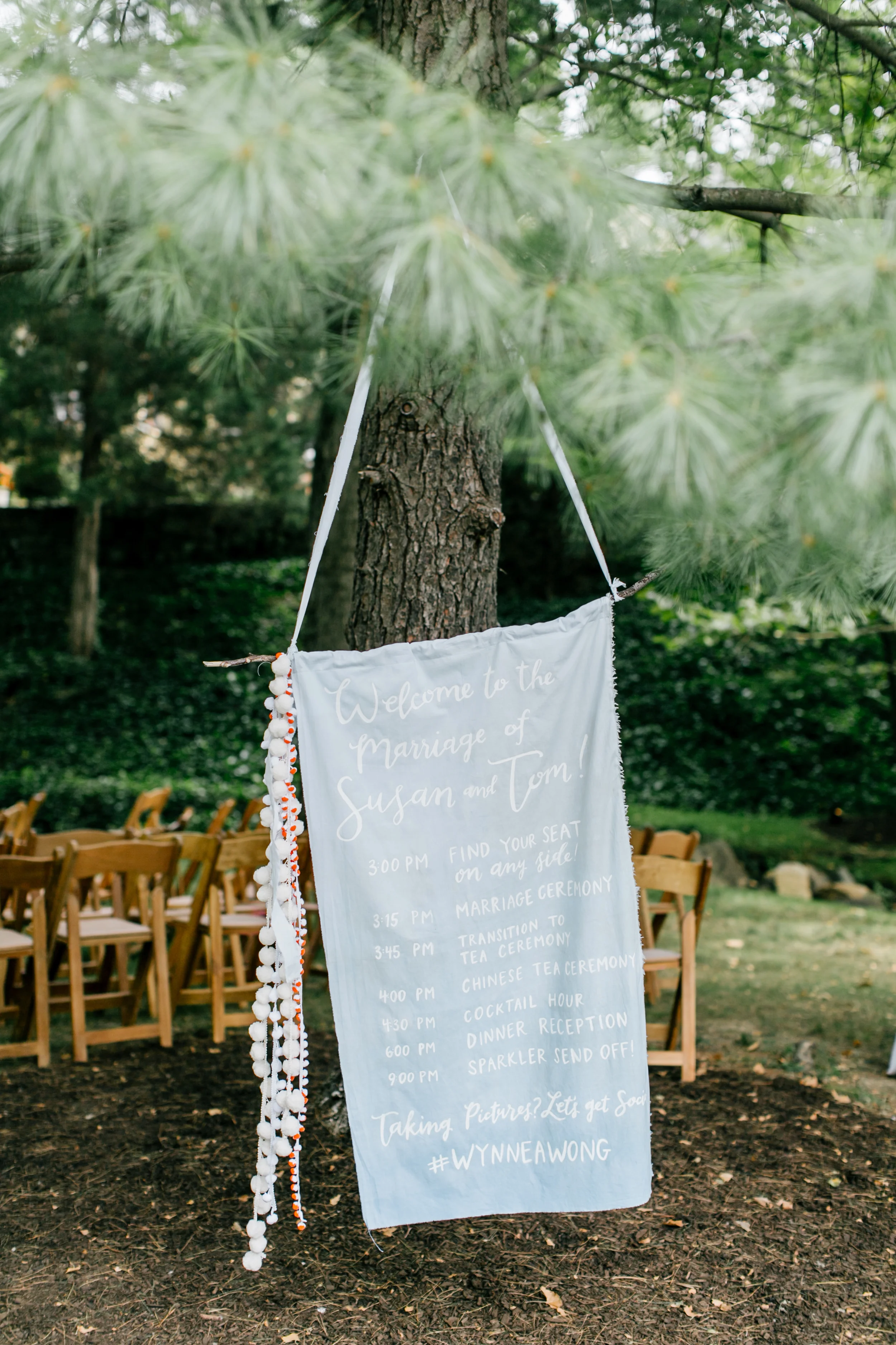 hand-dyed fabric ceremony program by hello, bird. // pom-pom tassels handcrafted by the bride + groom // photo by emily wren photography