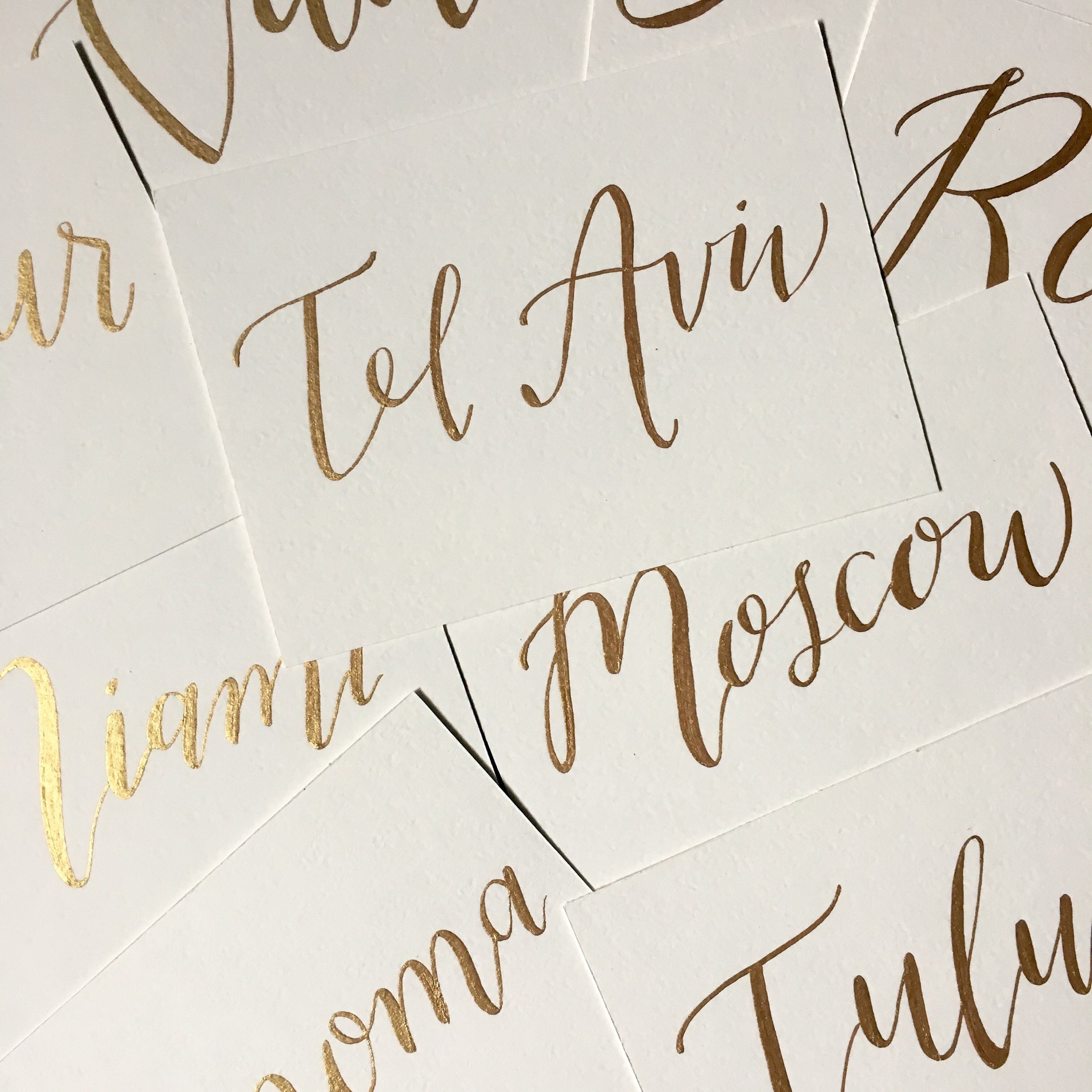 wendy bird style; table names in gold ink