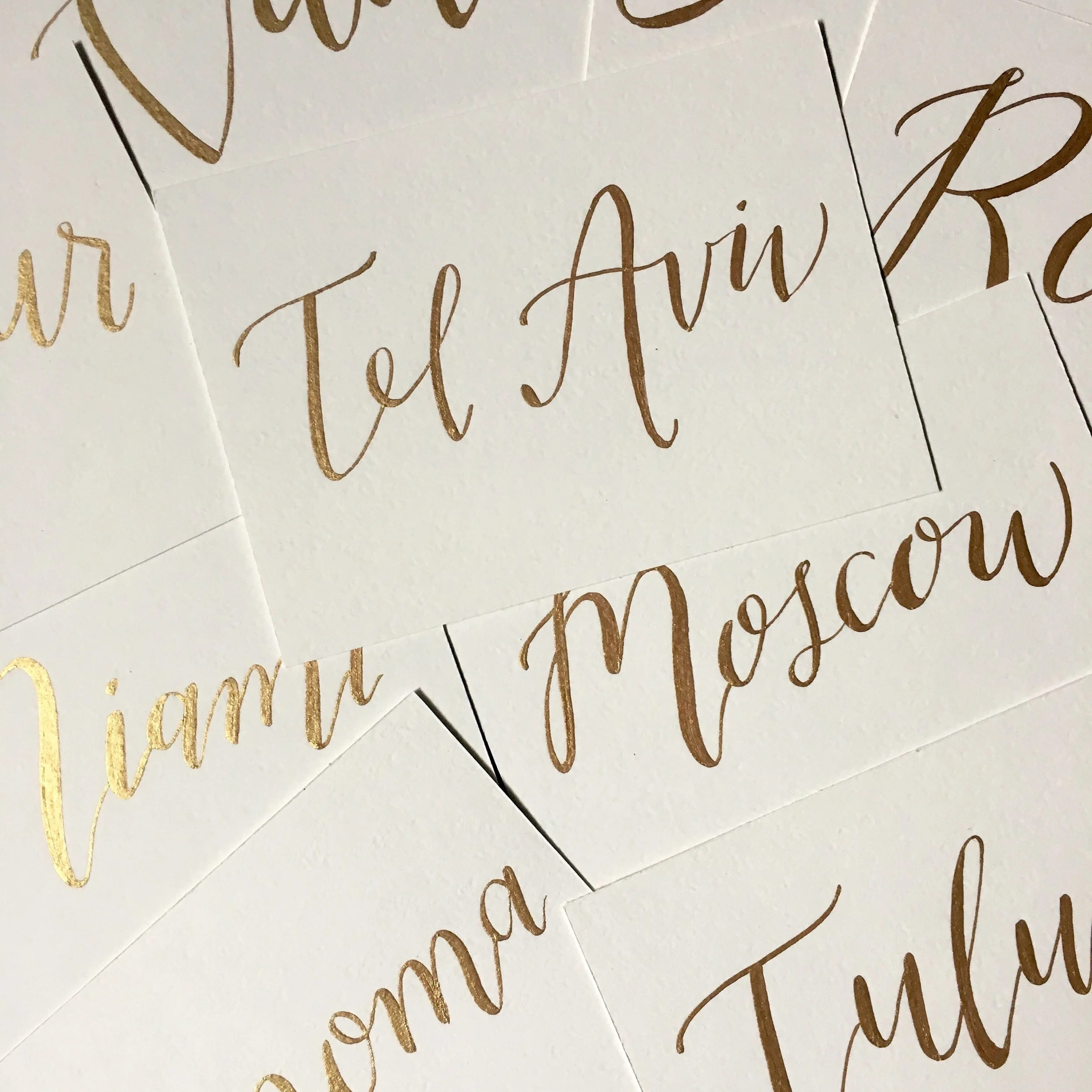 wendy bird style; table names in gold ink
