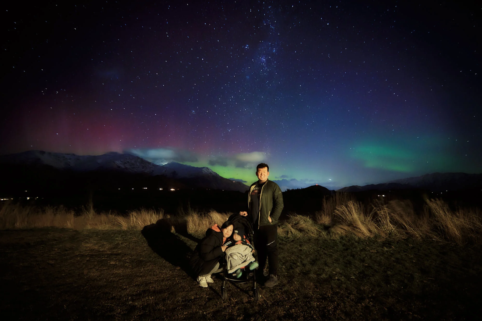 Backyard family selfie on a night with an aurora.