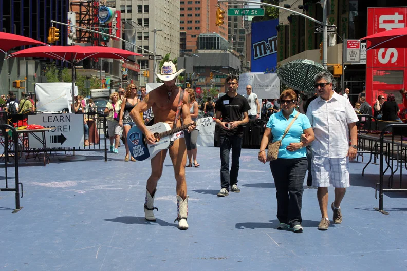 naked cowboy at the photo fair.jpg